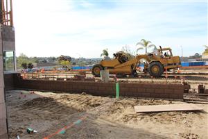 Grader working on parking lot 
