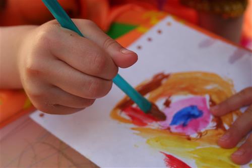 Child's hands painting 